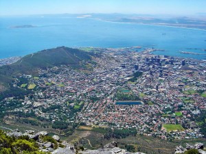 The central area of Cape Town and the Waterfront Harbour as seen from Table Mountain. The Island on the left is Robben Island where Nelson Mandela was kept imprisoned for so many years. Wikimedia Commons.