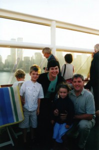 The family on board with the Twin Towers in the background.
